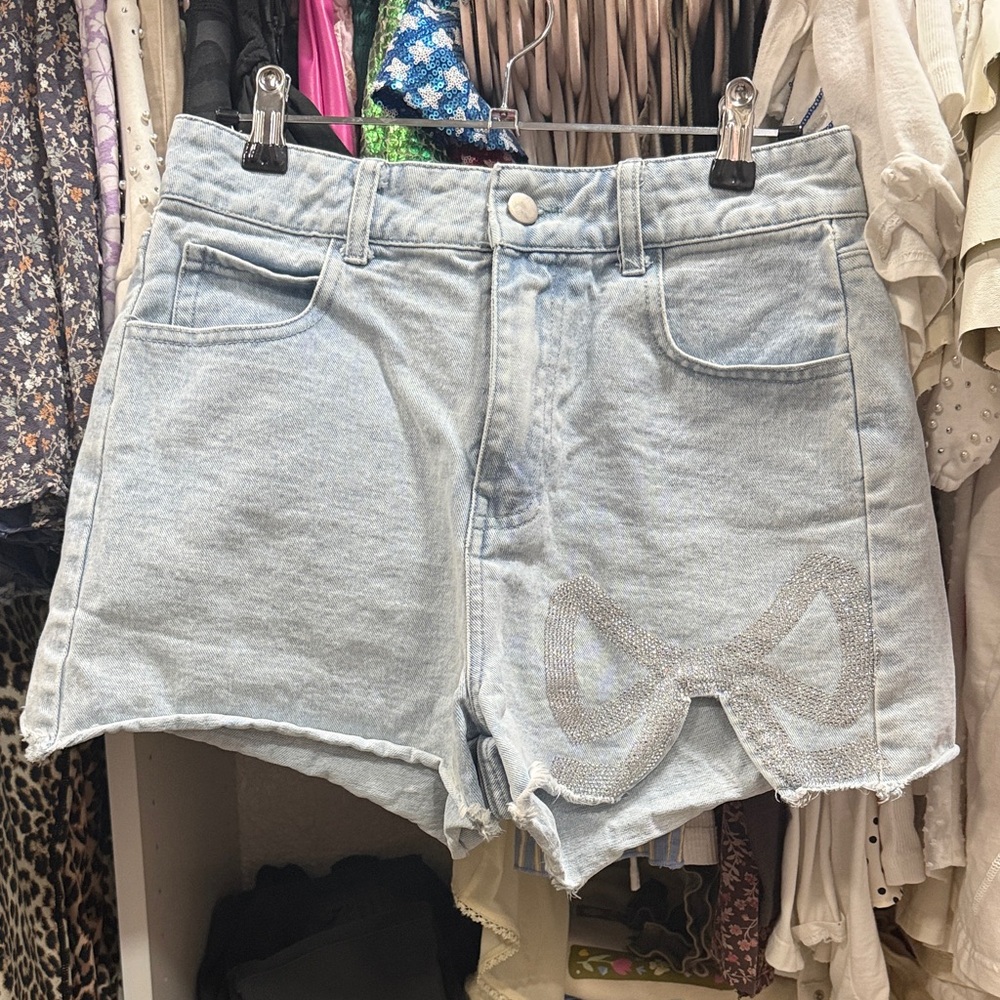 Peach Love California Light Wash Denim Shorts with Rhinestone Bow Detail